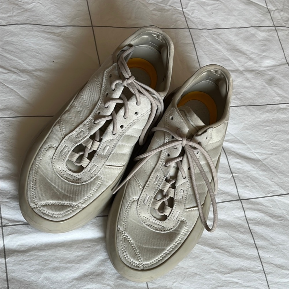 Adidas Cream Sneakers with Chunky Sole and Minimalist Design